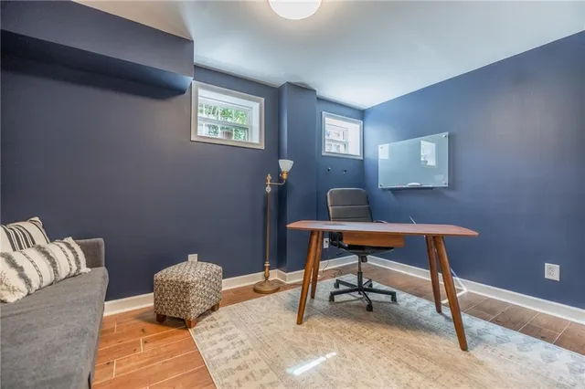 a living room with a couch and a window