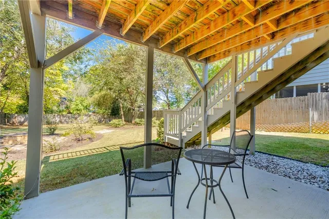 a balcony with wooden floor and fence