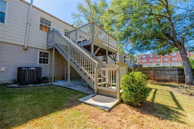 a balcony with wooden floor and fence
