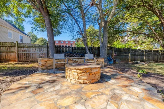 a swimming pool with trees in the background