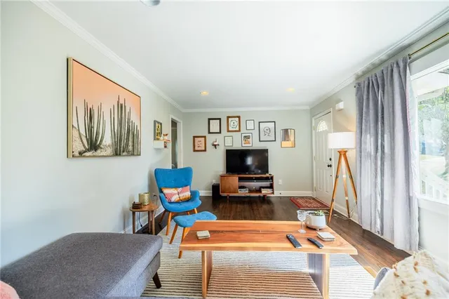 a room with furniture and a flat screen tv