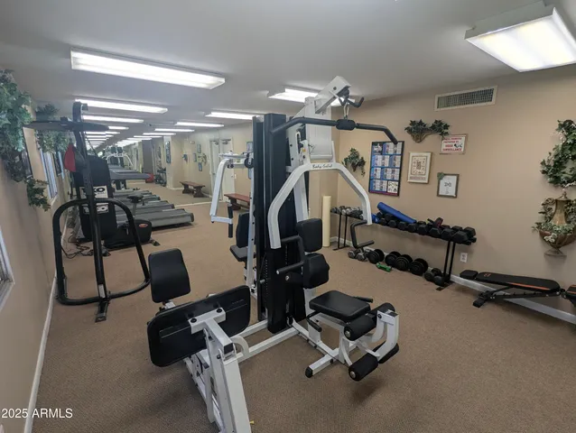a room with gym equipment and gym equipment