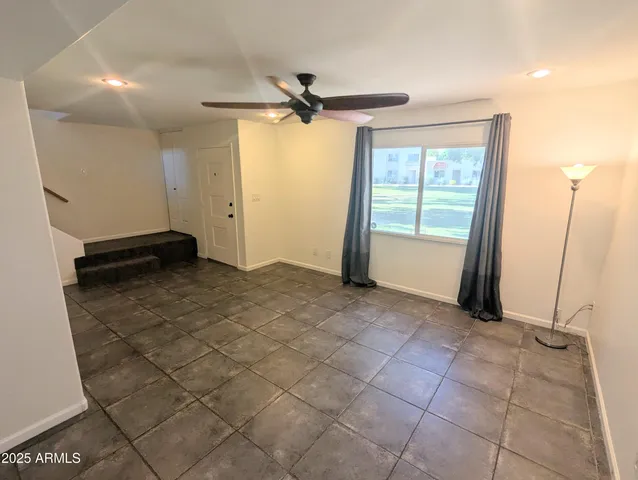 a view of a livingroom with a furniture and a window