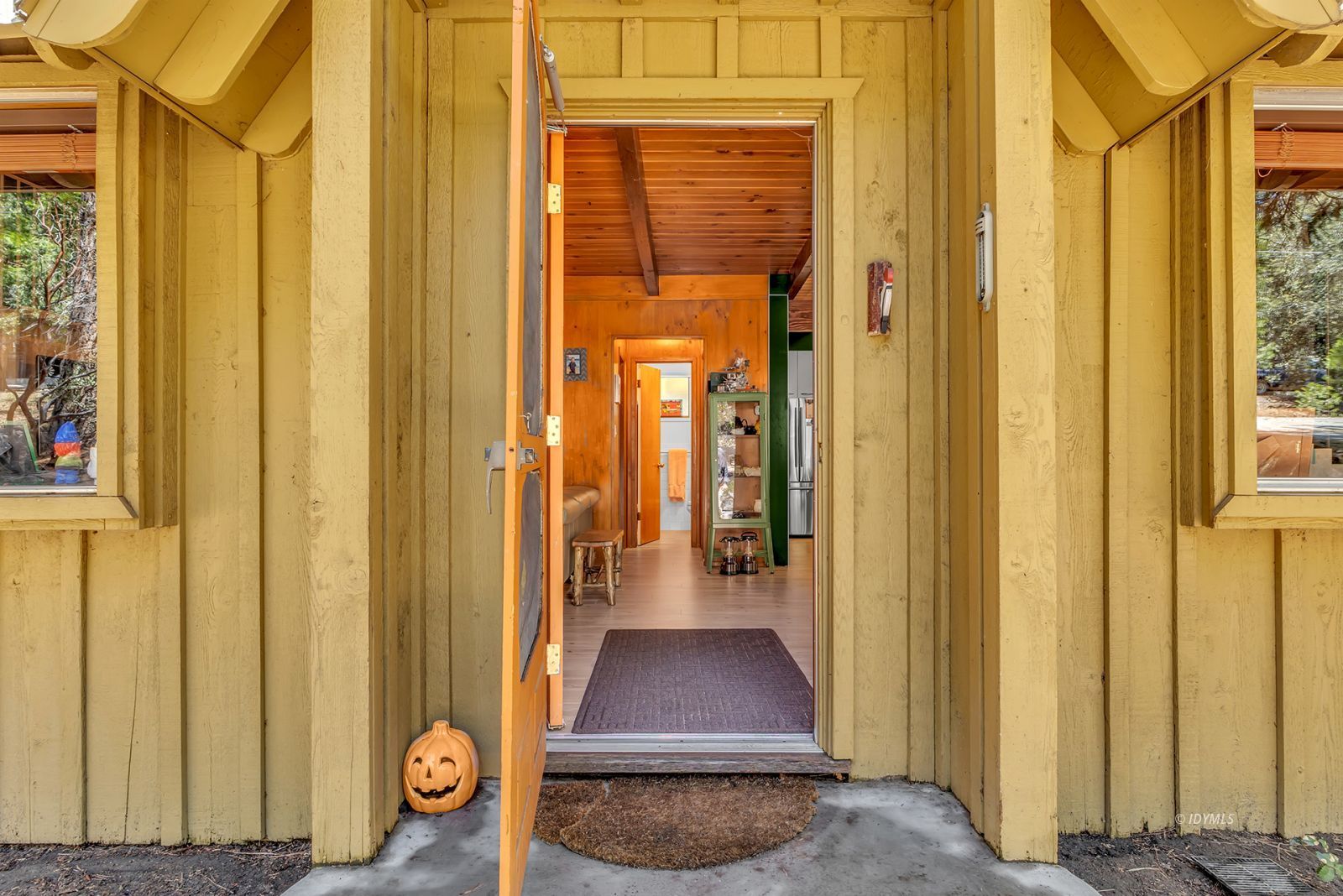 52143 Acorn Lane Idyllwild, CA 92549 - Photo 13 of 57 a view of a hallway with wooden floor and a door