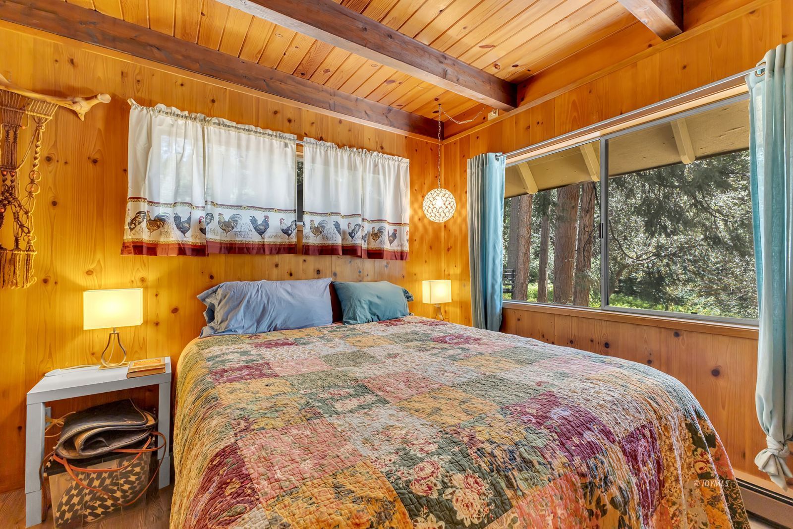 52143 Acorn Lane Idyllwild, CA 92549 - Photo 31 of 57 a bed sitting in a bedroom next to a window