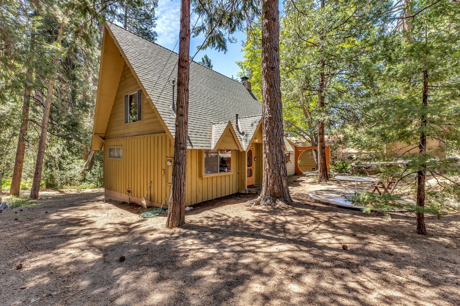 52143 Acorn Lane Idyllwild, CA 92549 - Photo 7 of 57 a view of a barn in the middle of a yard