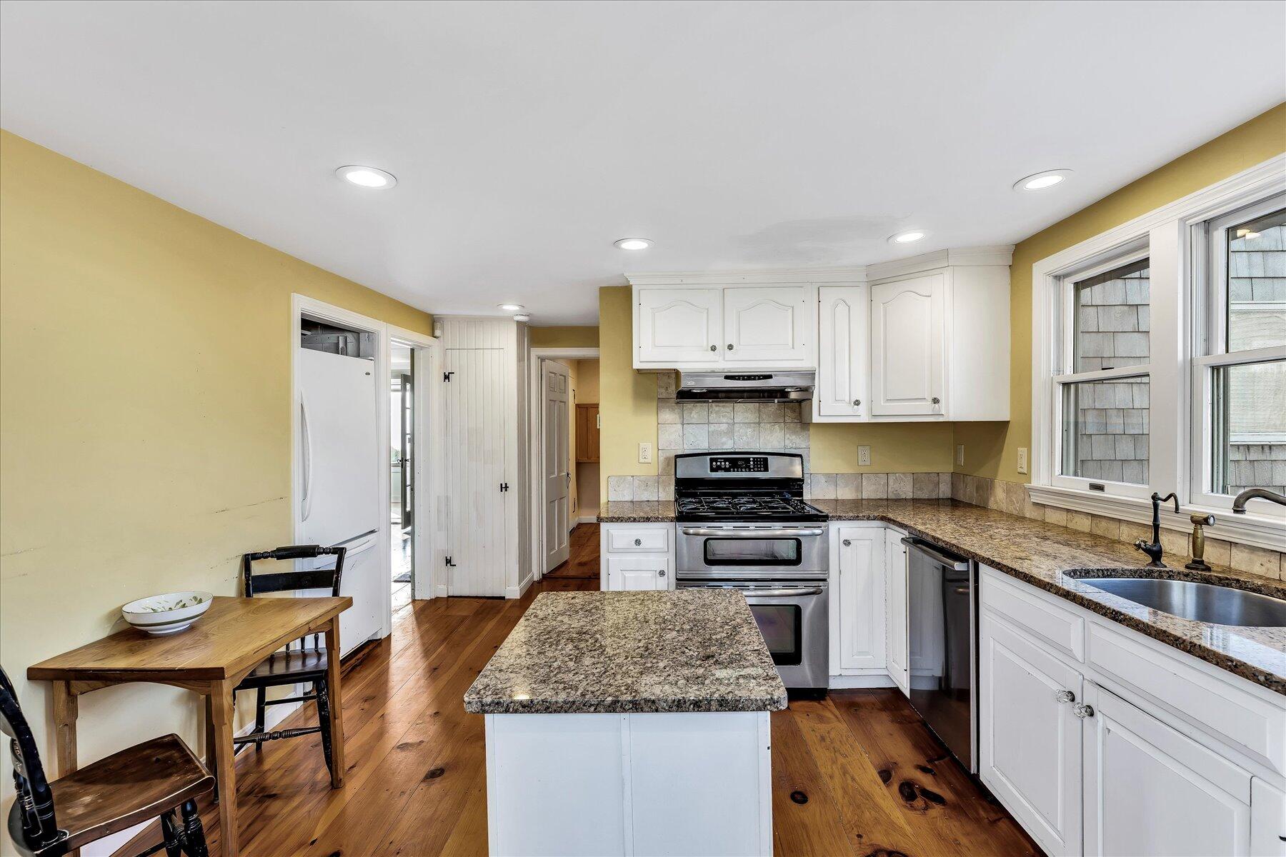9 Beach Pine Road Dennis Port, MA 02639 - Photo 20 of 52 a kitchen with stainless steel appliances granite countertop a sink stove and refrigerator