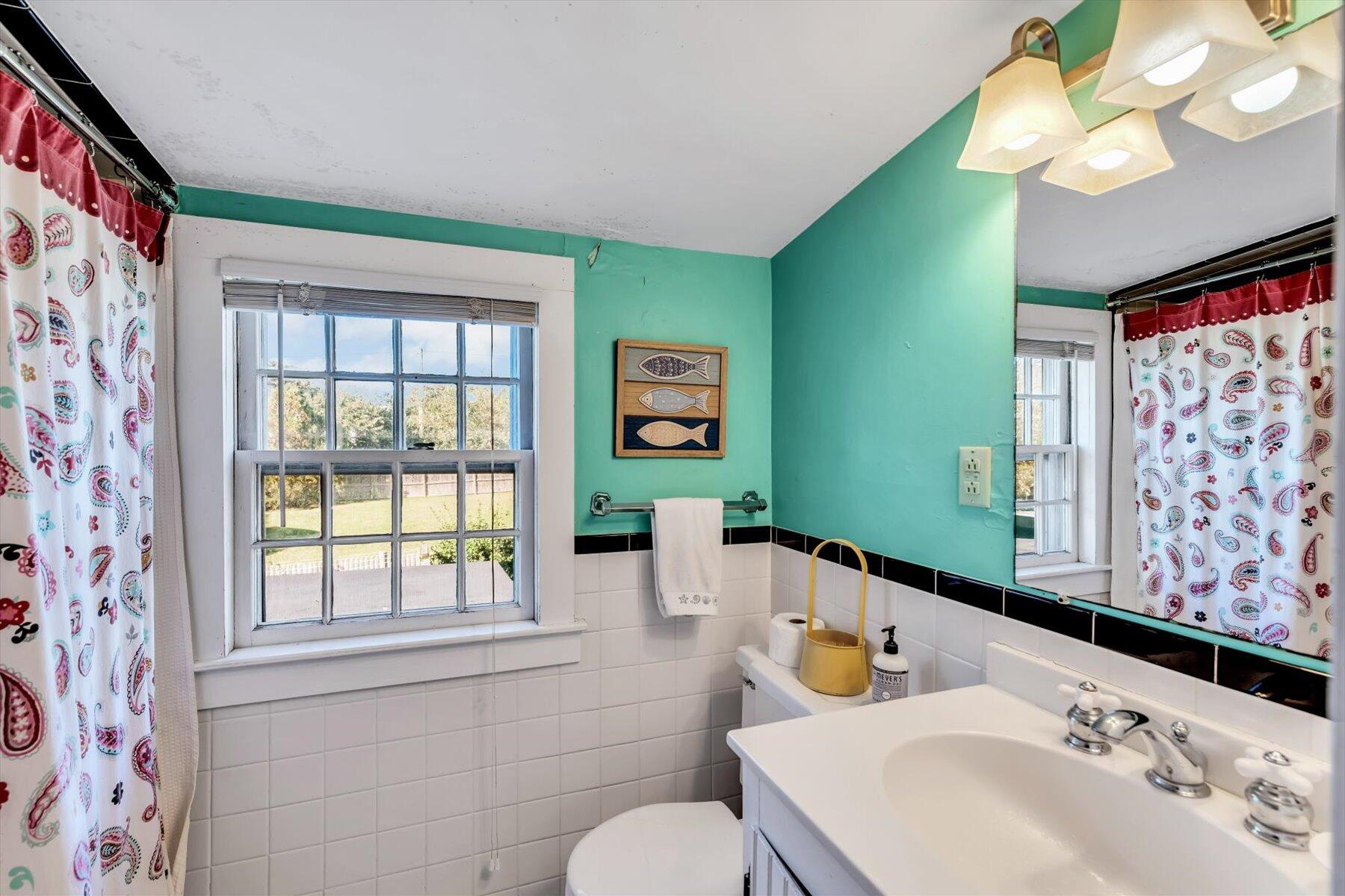 9 Beach Pine Road Dennis Port, MA 02639 - Photo 42 of 52 a bathroom with a sink mirror and window