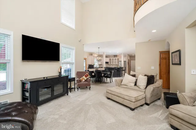 a bathroom with a sink a toilet and a large mirror