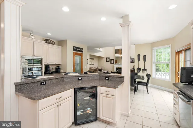 a view of backyard with swimming pool and seating space