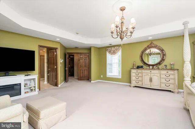 a view of backyard with table and chairs and potted plants
