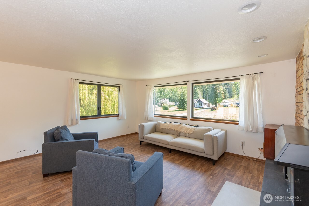 63 East Arnette Road Port Angeles, WA 98362 - Photo 13 of 40 a living room with furniture and a window