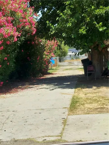 a view of a swimming pool with a yard