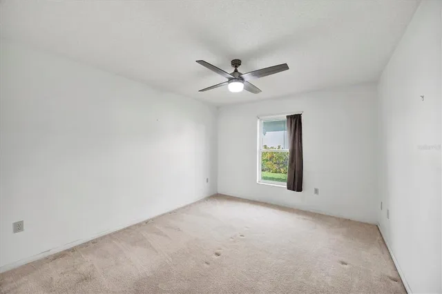 a bathroom with a double vanity sink a mirror and a bathtub