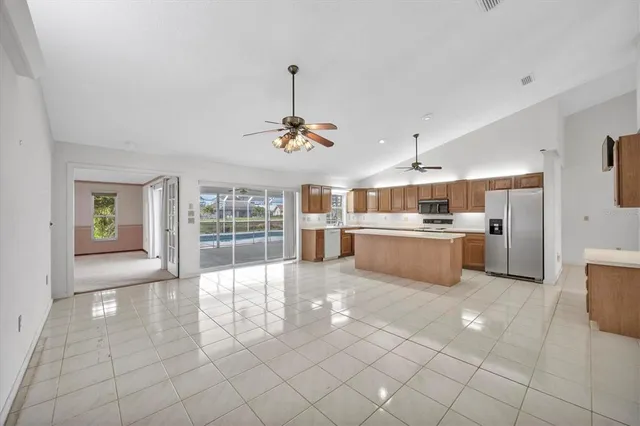 a large kitchen with cabinets and stainless steel appliances