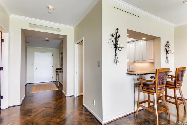 a view of a dining room with furniture and wooden floor