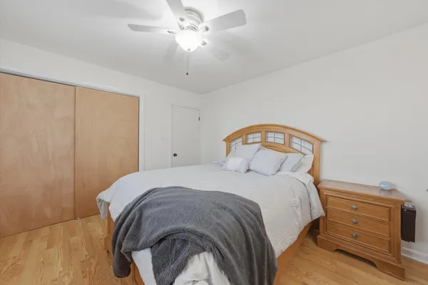 a bedroom with a bed and a dresser