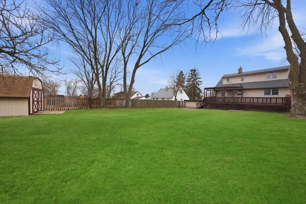 a view of a house with a back yard