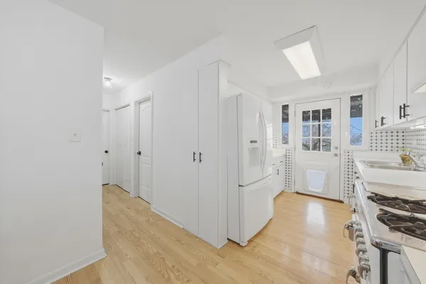 a view of kitchen with furniture and wooden floor