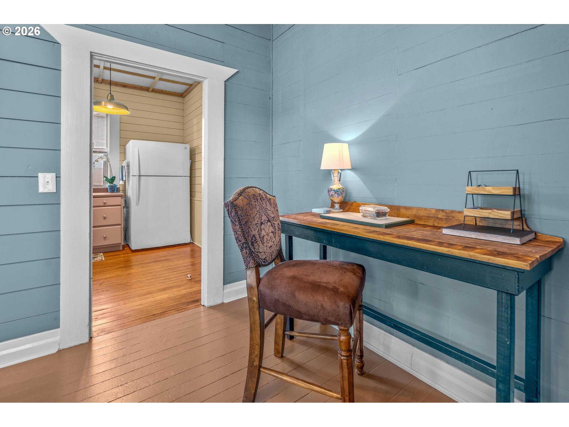 240 Southwest Bryant Street Clatskanie, OR 97016 - Photo 11 of 30 a workspace with furniture and wooden floor