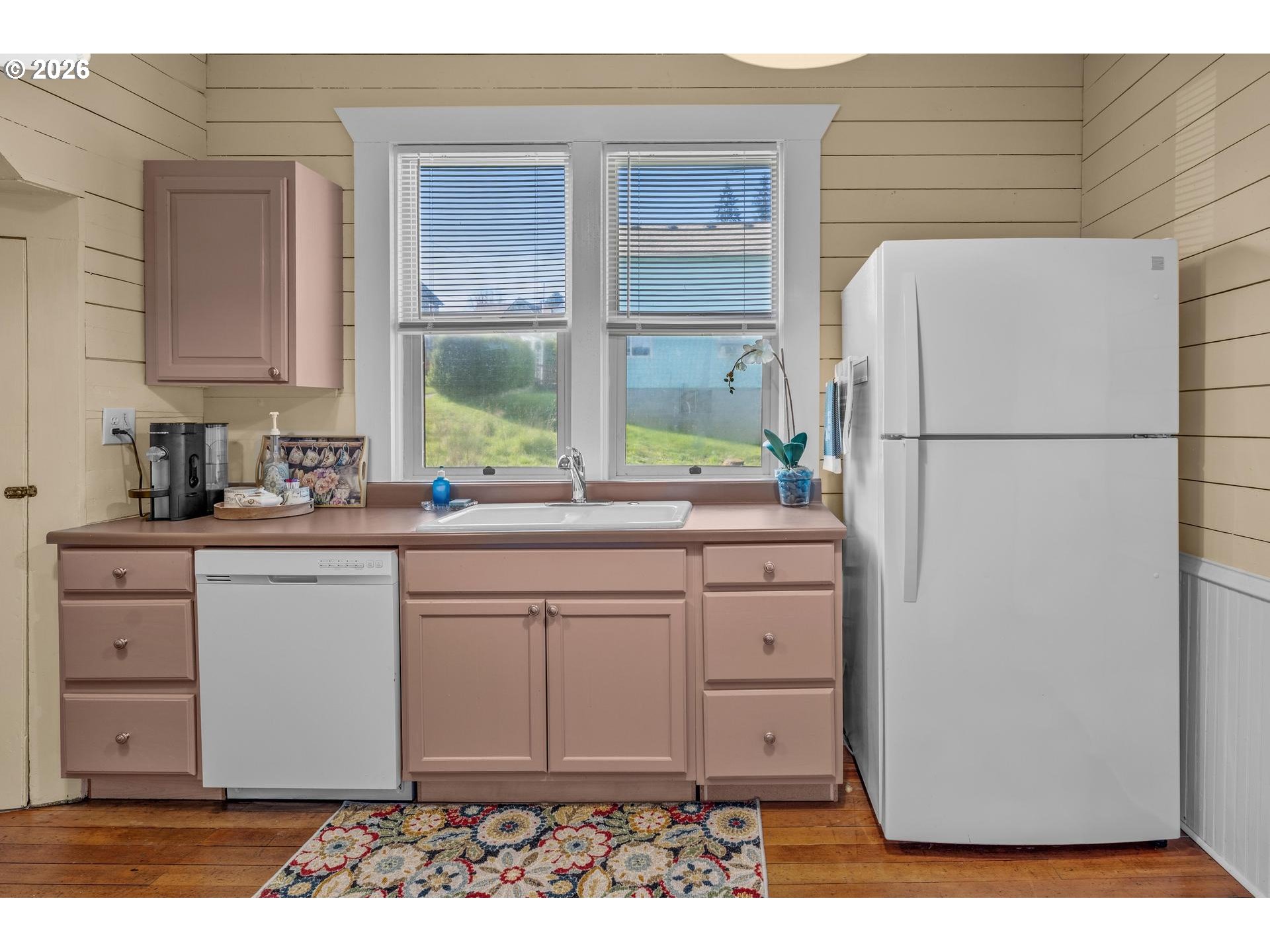 240 Southwest Bryant Street Clatskanie, OR 97016 - Photo 12 of 30 a kitchen with a refrigerator and a sink