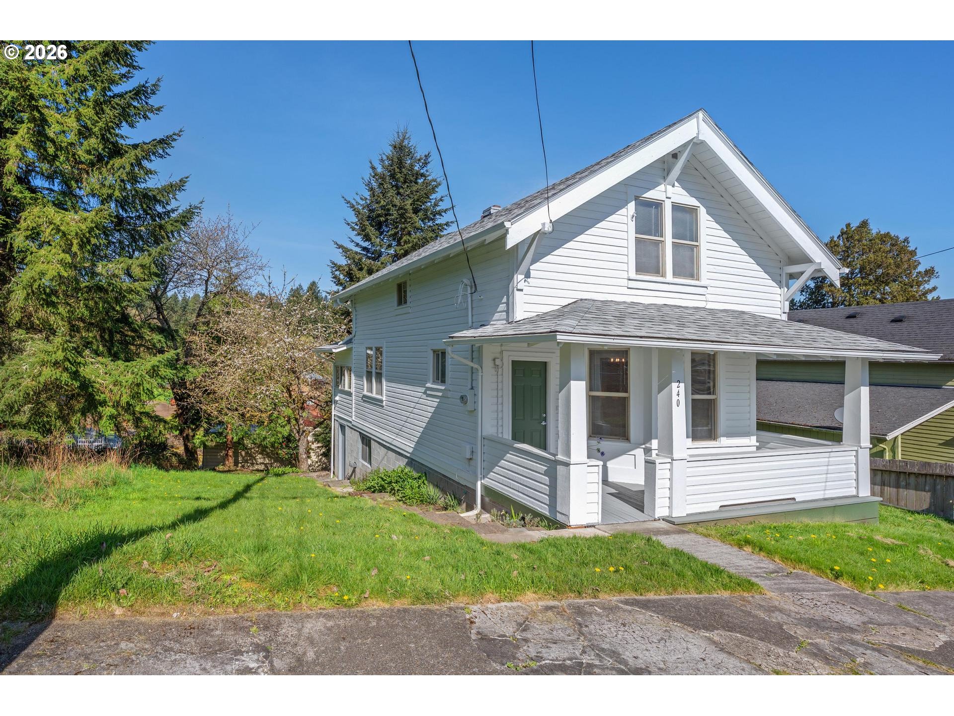 240 Southwest Bryant Street Clatskanie, OR 97016 - Photo 2 of 30 a front view of a house with a yard