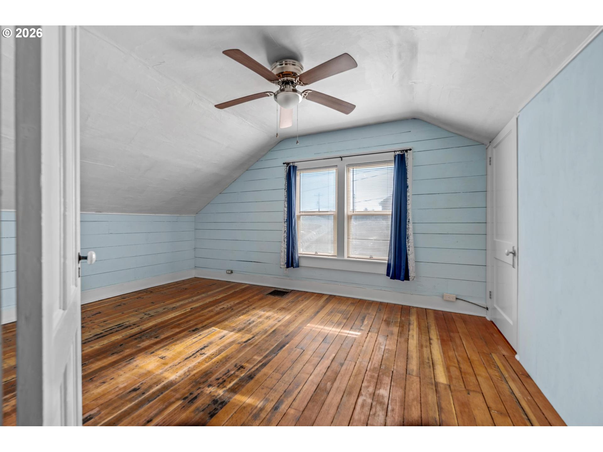 240 Southwest Bryant Street Clatskanie, OR 97016 - Photo 22 of 30 a view of an empty room with wooden floor and a window