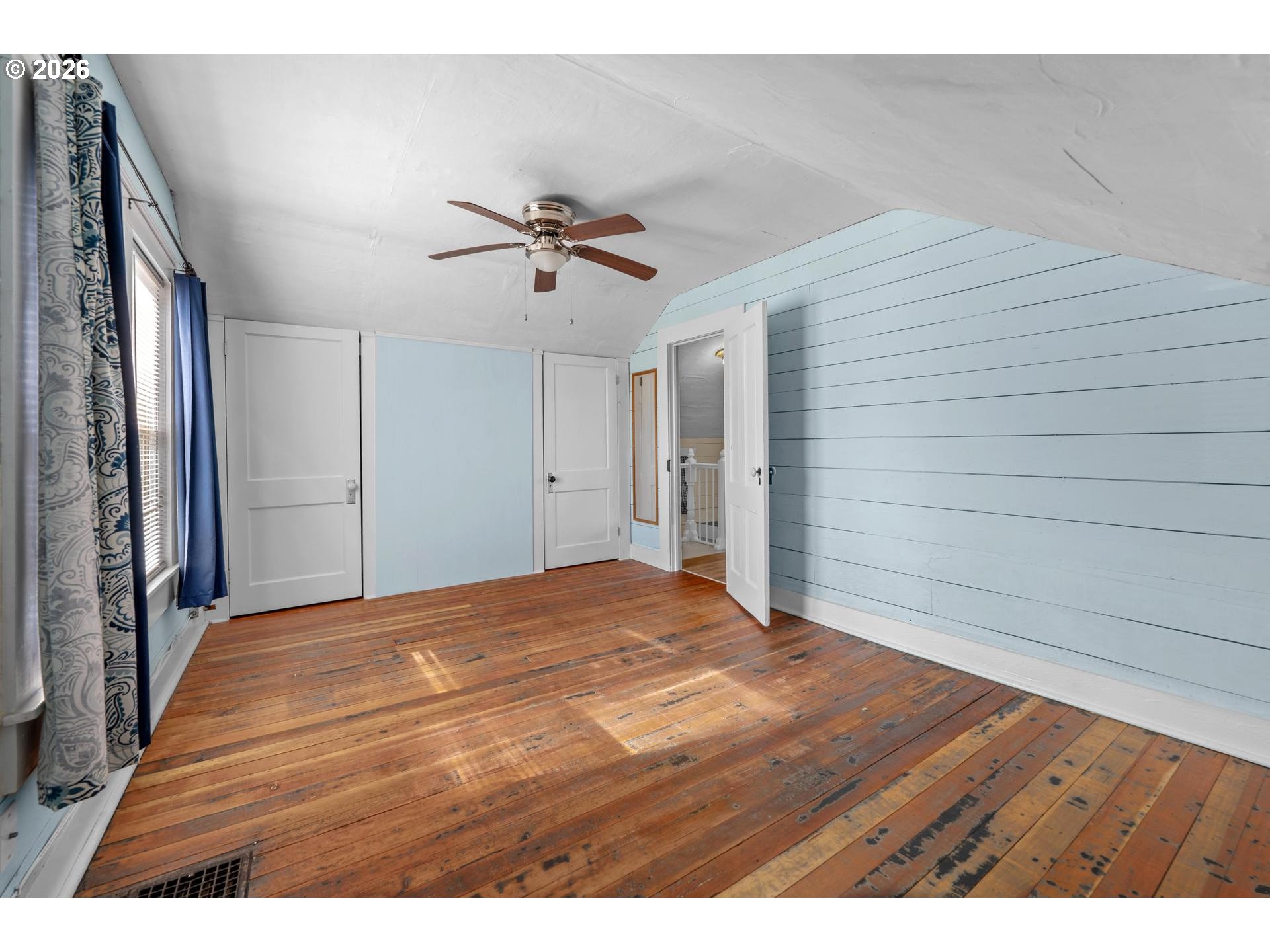 240 Southwest Bryant Street Clatskanie, OR 97016 - Photo 23 of 30 a view of empty room with wooden floor and fan
