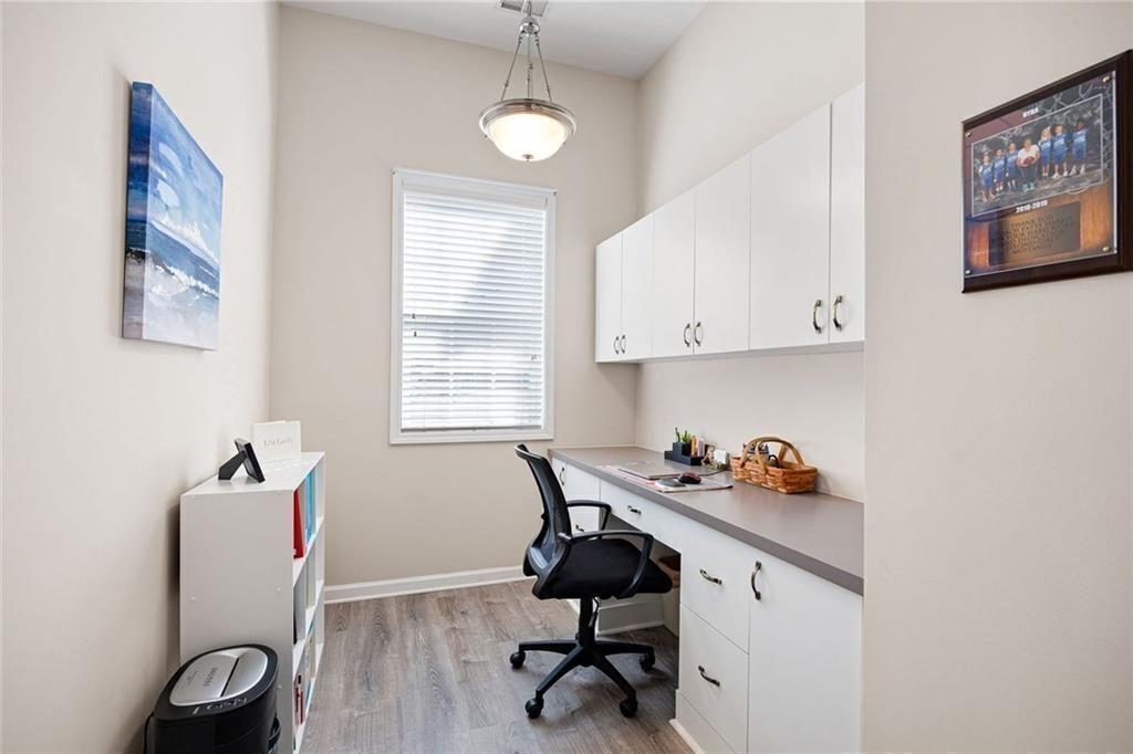 3807 Abbott Lane Southwest, Unit 15 Powder Springs, GA 30127 - Photo 18 of 32 a view of workspace with wooden floor windows cabinet and window