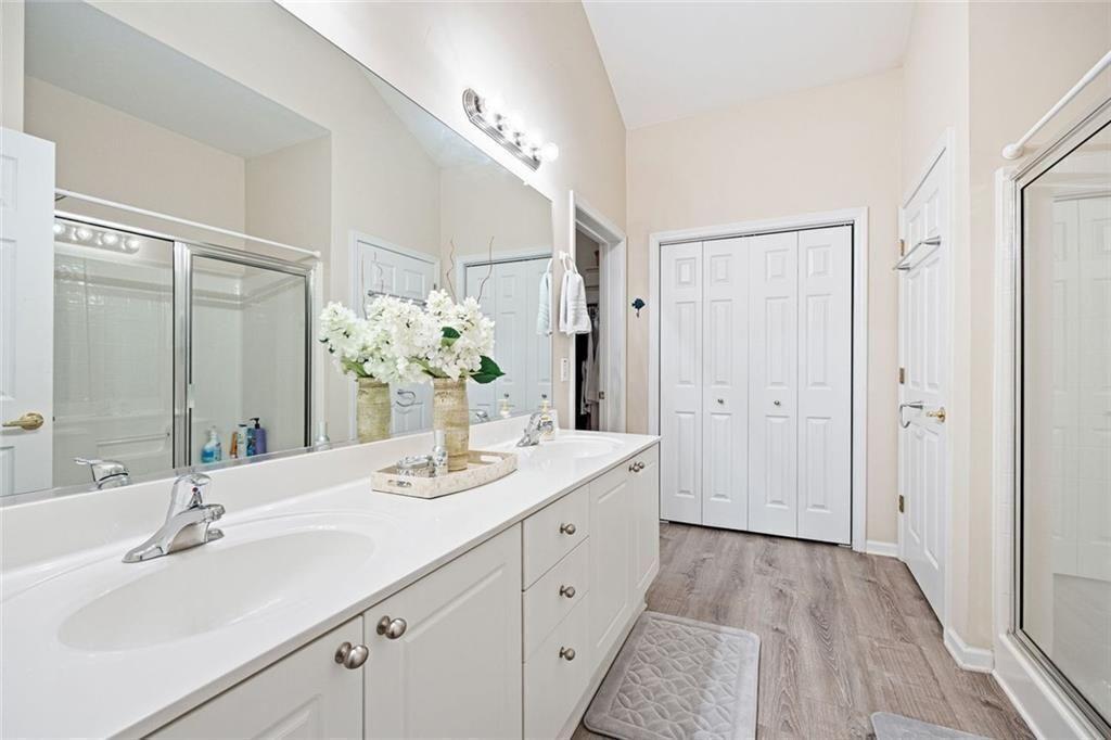 3807 Abbott Lane Southwest, Unit 15 Powder Springs, GA 30127 - Photo 21 of 32 a bathroom with a sink and a mirror
