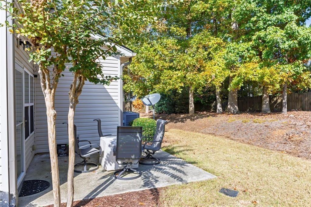 3807 Abbott Lane Southwest, Unit 15 Powder Springs, GA 30127 - Photo 28 of 32 a view of a backyard with sitting area