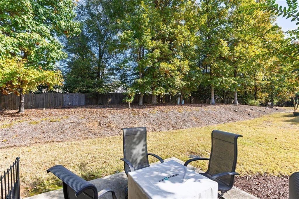 3807 Abbott Lane Southwest, Unit 15 Powder Springs, GA 30127 - Photo 29 of 32 a view of a swimming pool with a patio