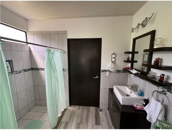 a bathroom with a sink and mirror