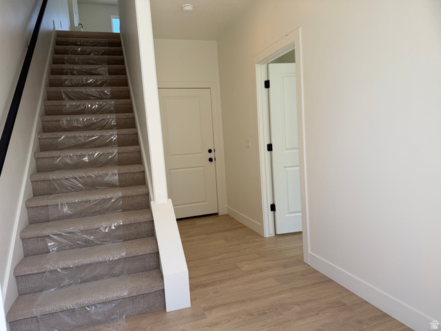 10995 South Freestone Road, Unit 109 South Jordan, UT 84009 - Photo 2 of 20 Stairs featuring wood finished floors and baseboards