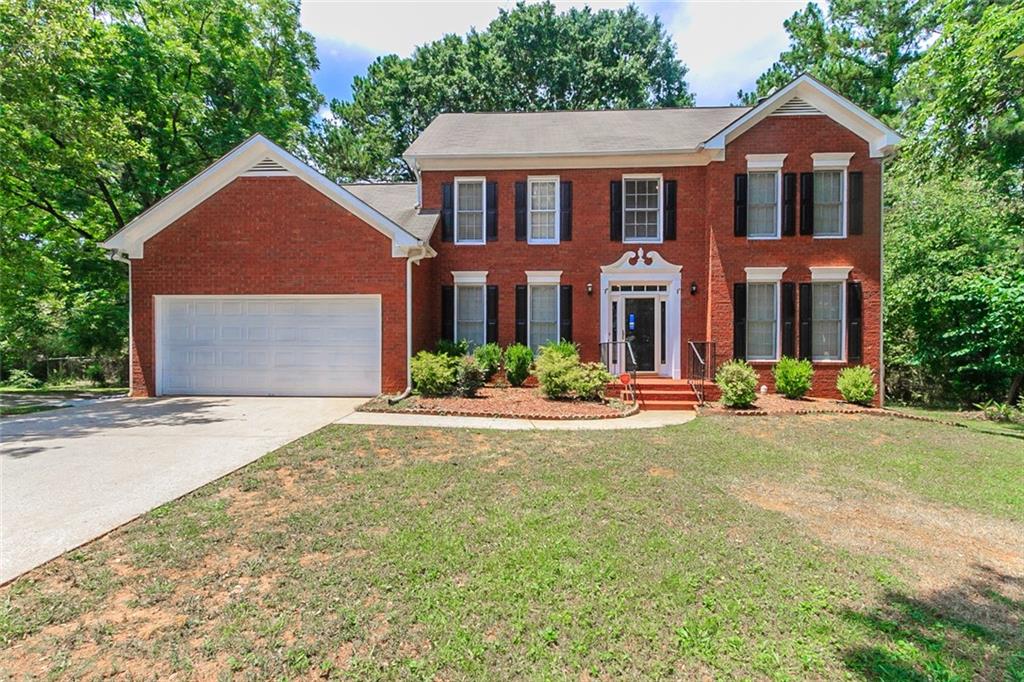 3848 Brookview Point Decatur, GA 30034 - Photo 1 of 1 a front view of a house with yard and green space
