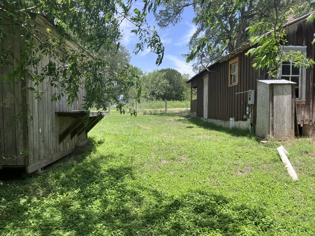 Additional outbuilding with exterior work bench.
