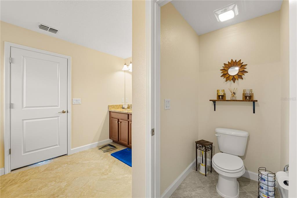 12041 Cardinal Flower Drive Riverview, FL 33579 - Photo 18 of 58 a bathroom with a toilet and a sink