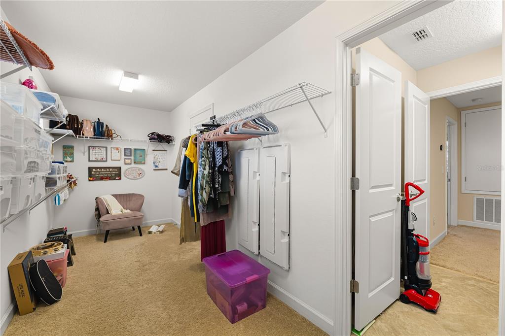 12041 Cardinal Flower Drive Riverview, FL 33579 - Photo 19 of 58 a view of a hallway with workspace and a couch