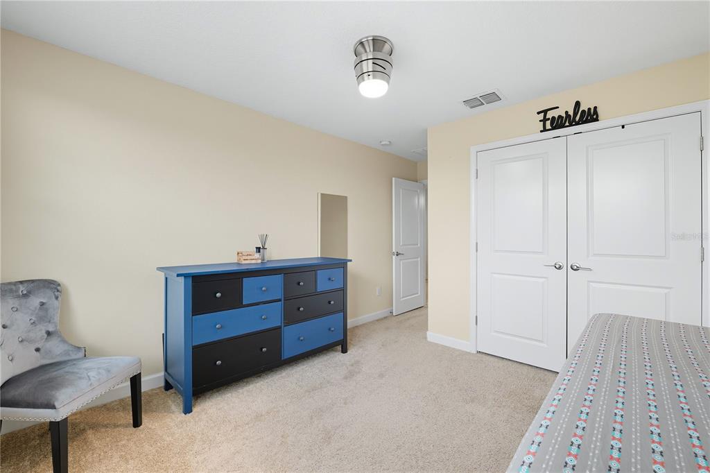 12041 Cardinal Flower Drive Riverview, FL 33579 - Photo 23 of 58 a bed room with a bed and a couch