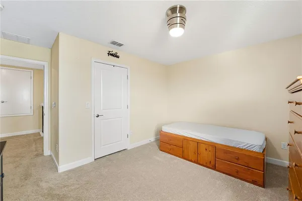 a view of a porch with furniture and garden