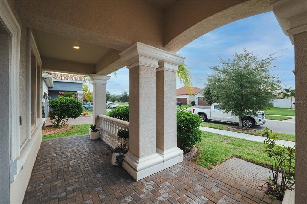 12041 Cardinal Flower Drive Riverview, FL 33579 - Photo 33 of 58 a view of a porch with furniture and garden