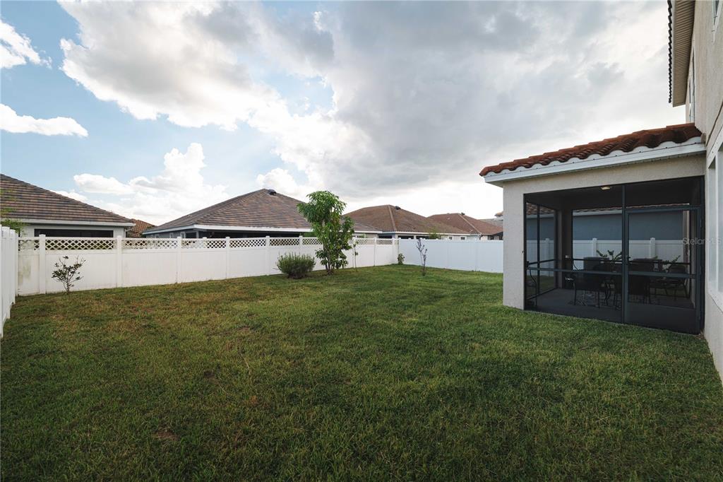 12041 Cardinal Flower Drive Riverview, FL 33579 - Photo 39 of 58 a view of a house with a yard and a garden