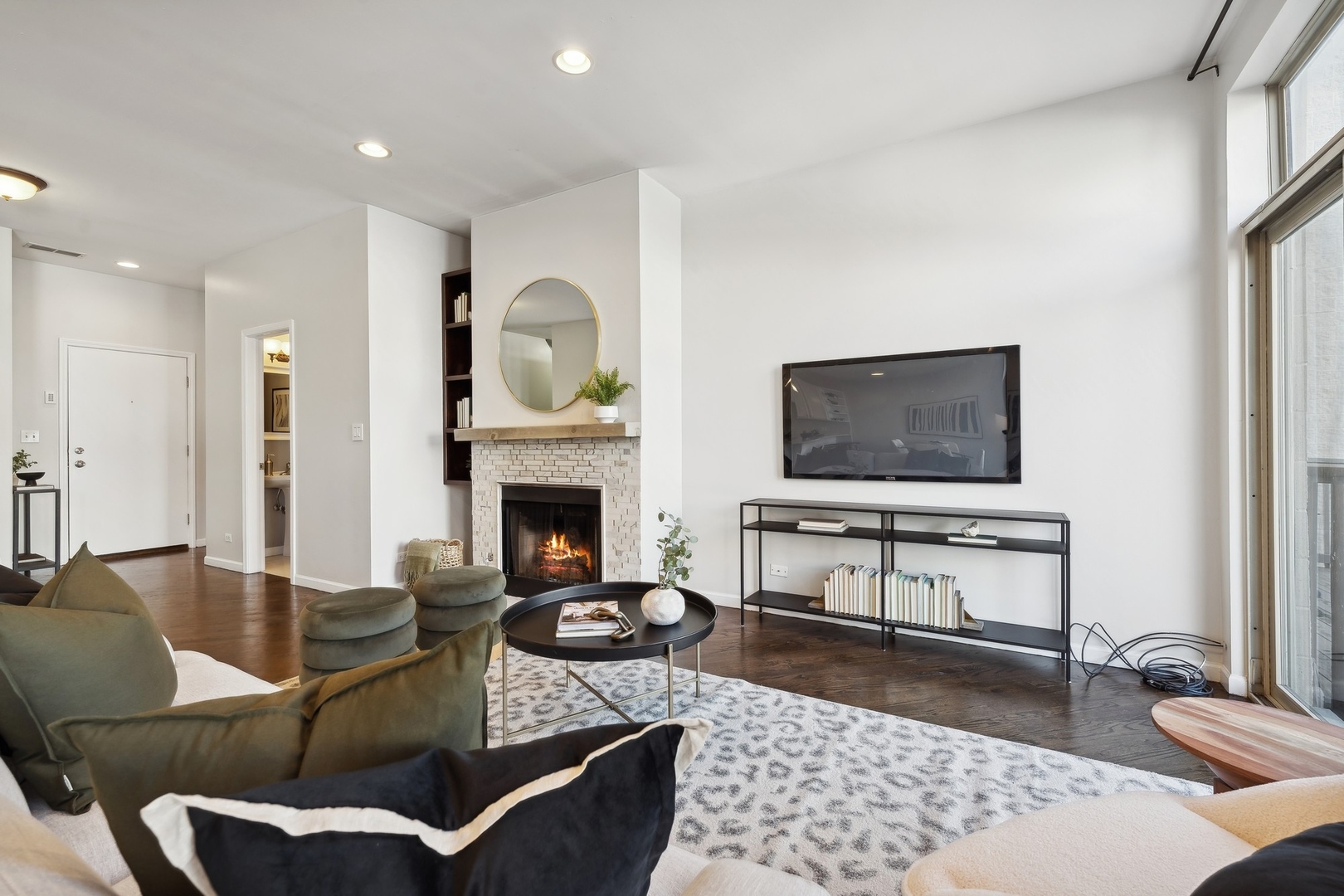 2124 West Division Street, Unit 3 Chicago, IL 60622 - Photo 11 of 33 a living room with furniture a rug and a fireplace