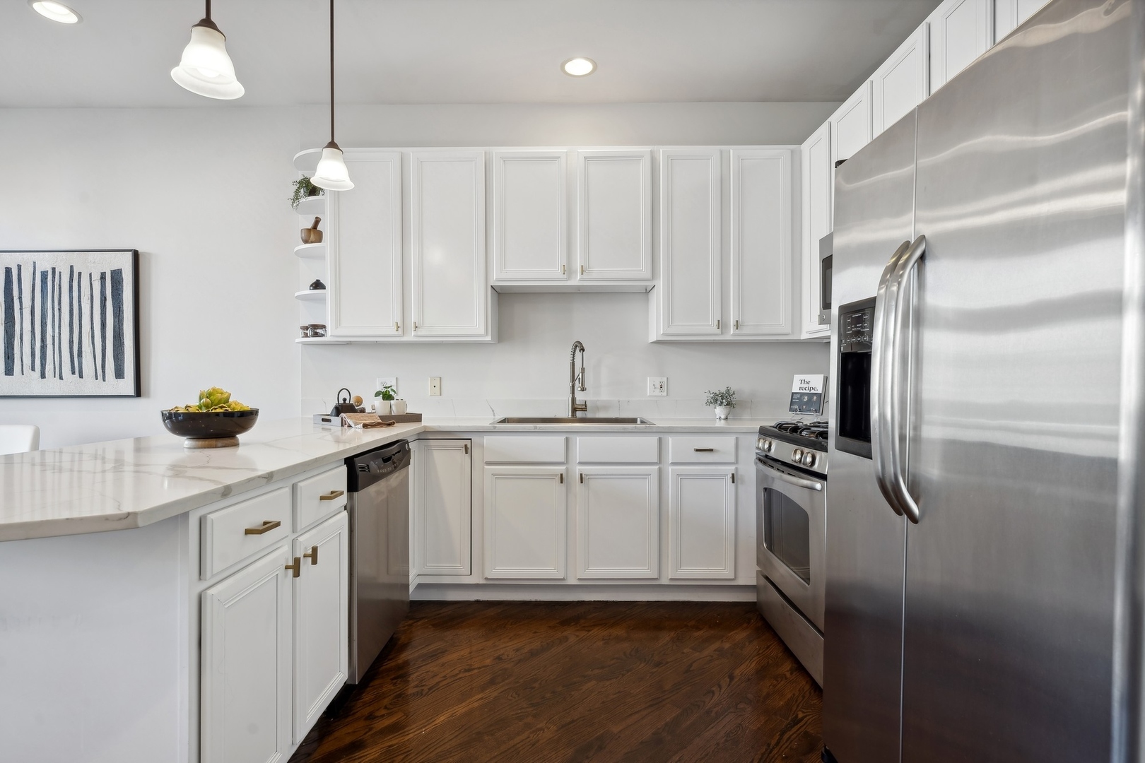 2124 West Division Street, Unit 3 Chicago, IL 60622 - Photo 18 of 33 a kitchen with granite countertop a sink stainless steel appliances and cabinets