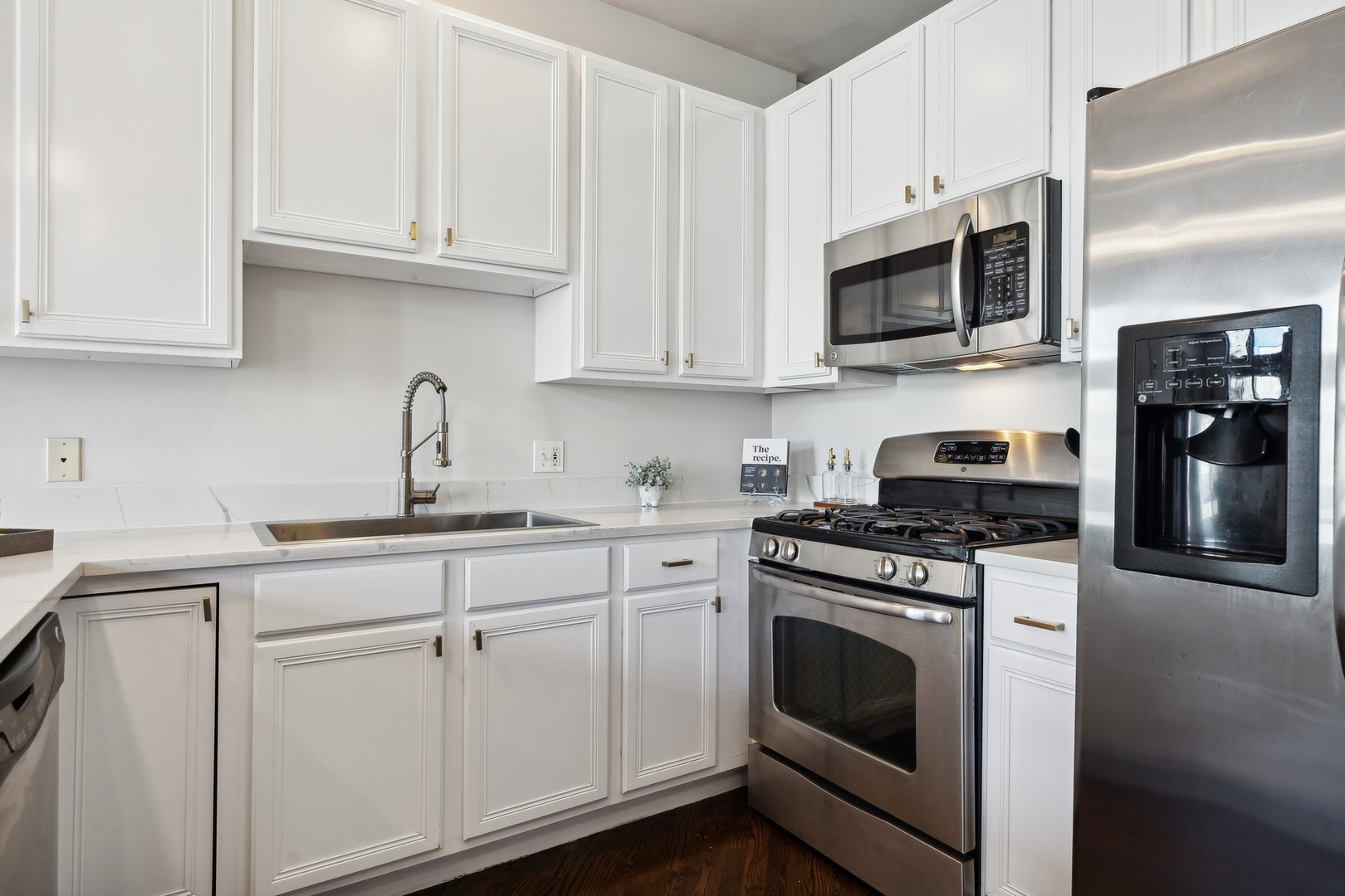 2124 West Division Street, Unit 3 Chicago, IL 60622 - Photo 19 of 33 a kitchen with white cabinets and stainless steel appliances