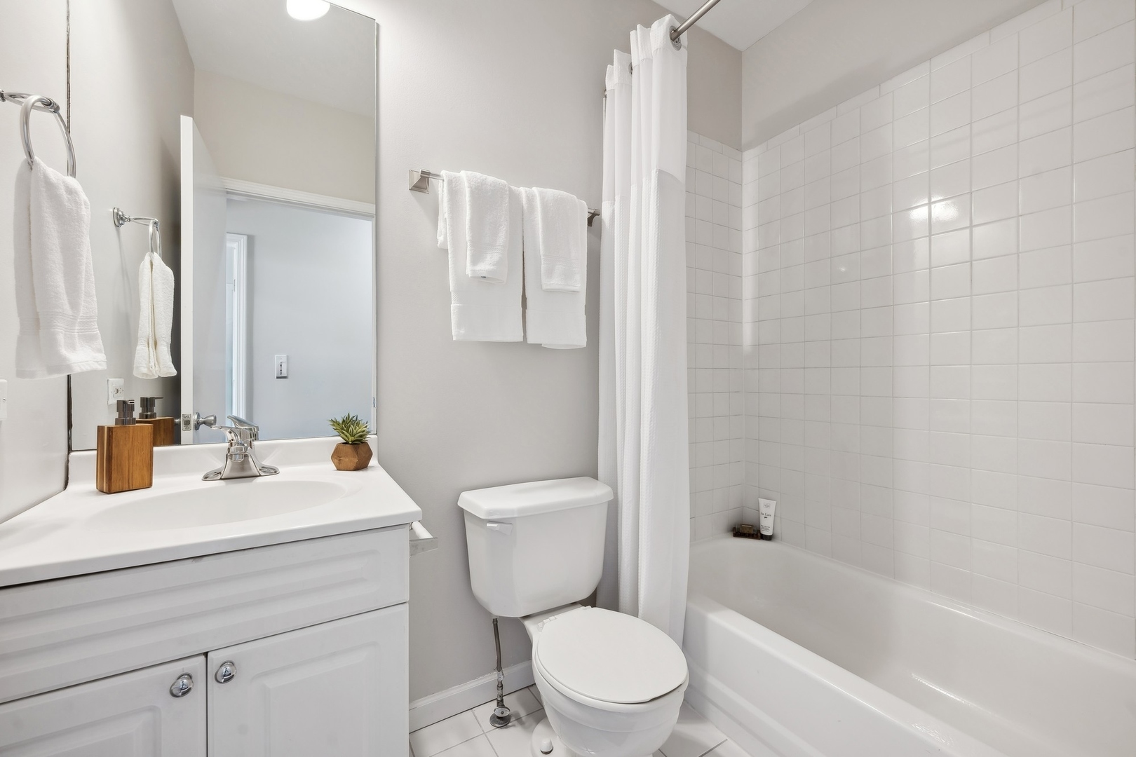 2124 West Division Street, Unit 3 Chicago, IL 60622 - Photo 28 of 33 a bathroom with a sink a toilet and shower curtain