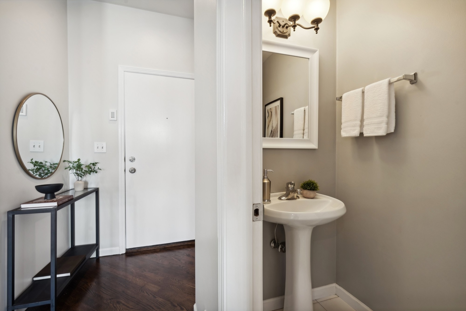 2124 West Division Street, Unit 3 Chicago, IL 60622 - Photo 4 of 33 a bathroom with a sink a mirror and a window