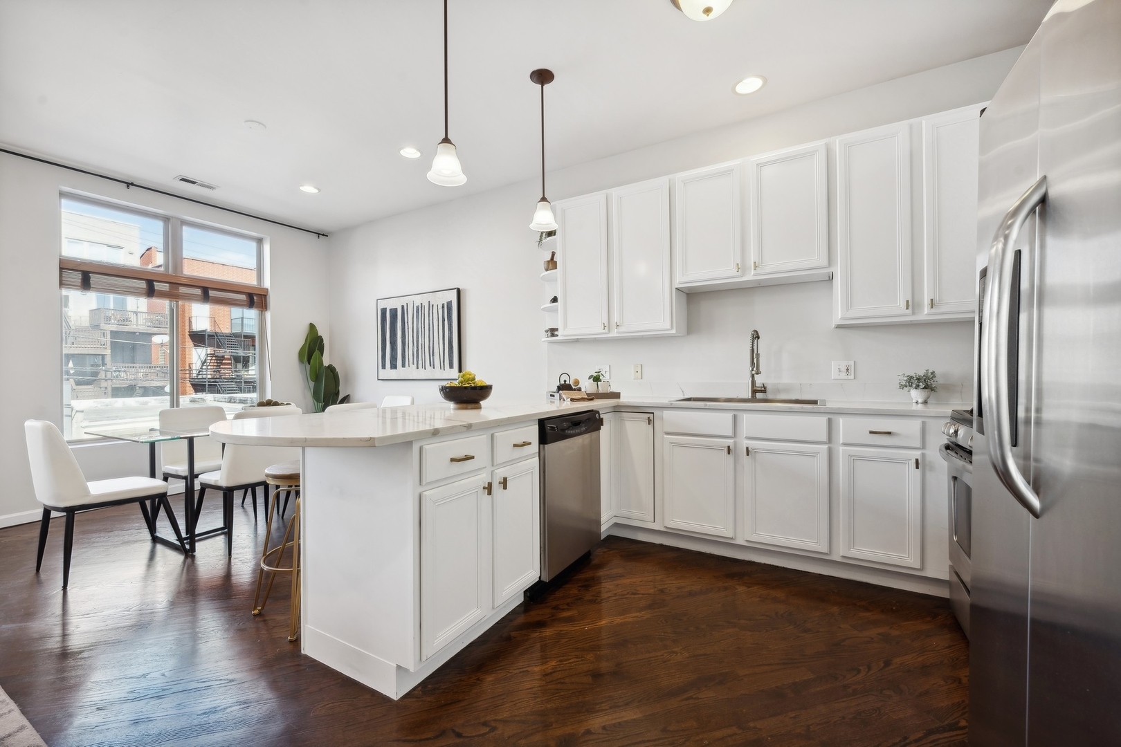 2124 West Division Street, Unit 3 Chicago, IL 60622 - Photo 7 of 33 a kitchen with white cabinets and white appliances