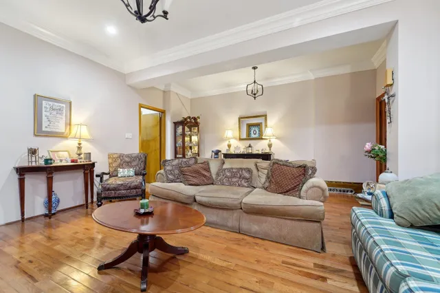 a living room with furniture and a dining table