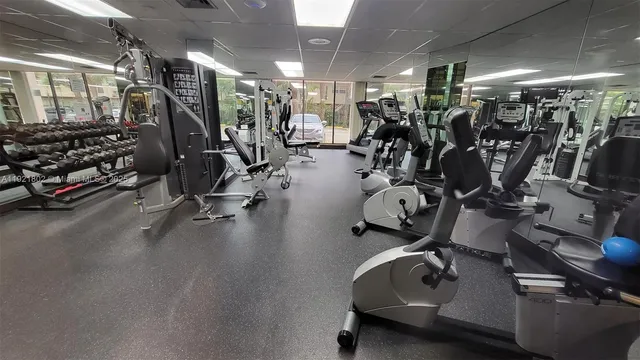 a room with chairs pool table and a table